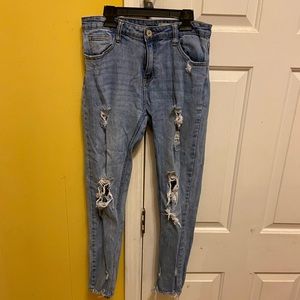 Distressed ankle length light-wash denim girlfriend jeans